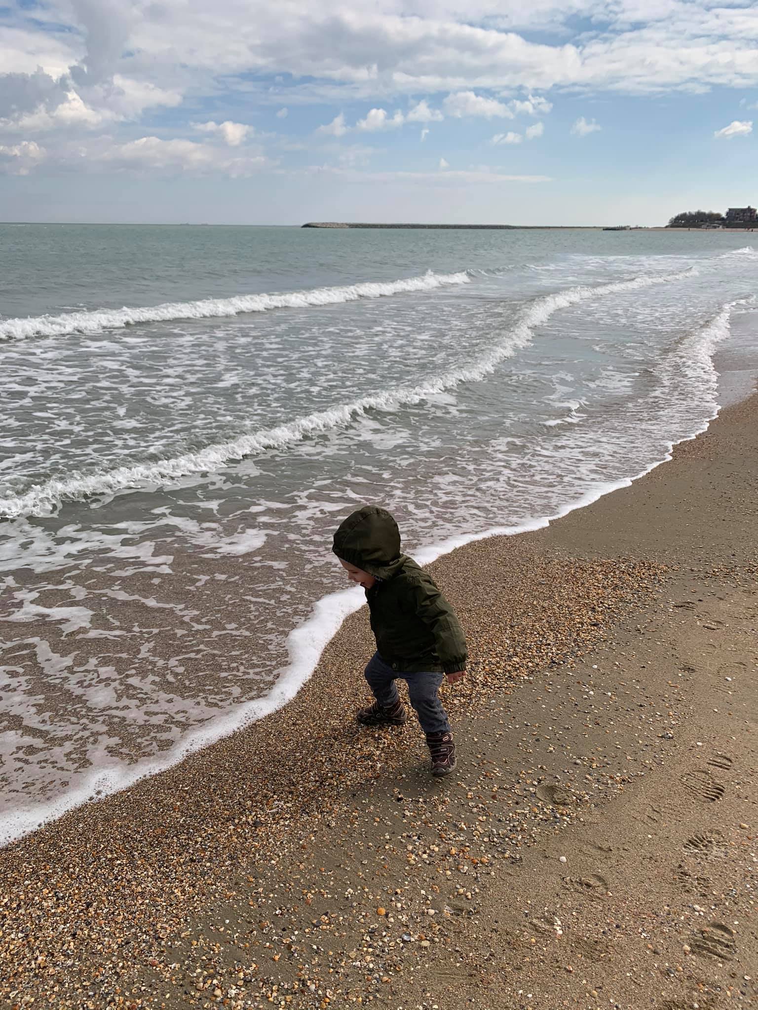 May be an image of child, standing and ocean